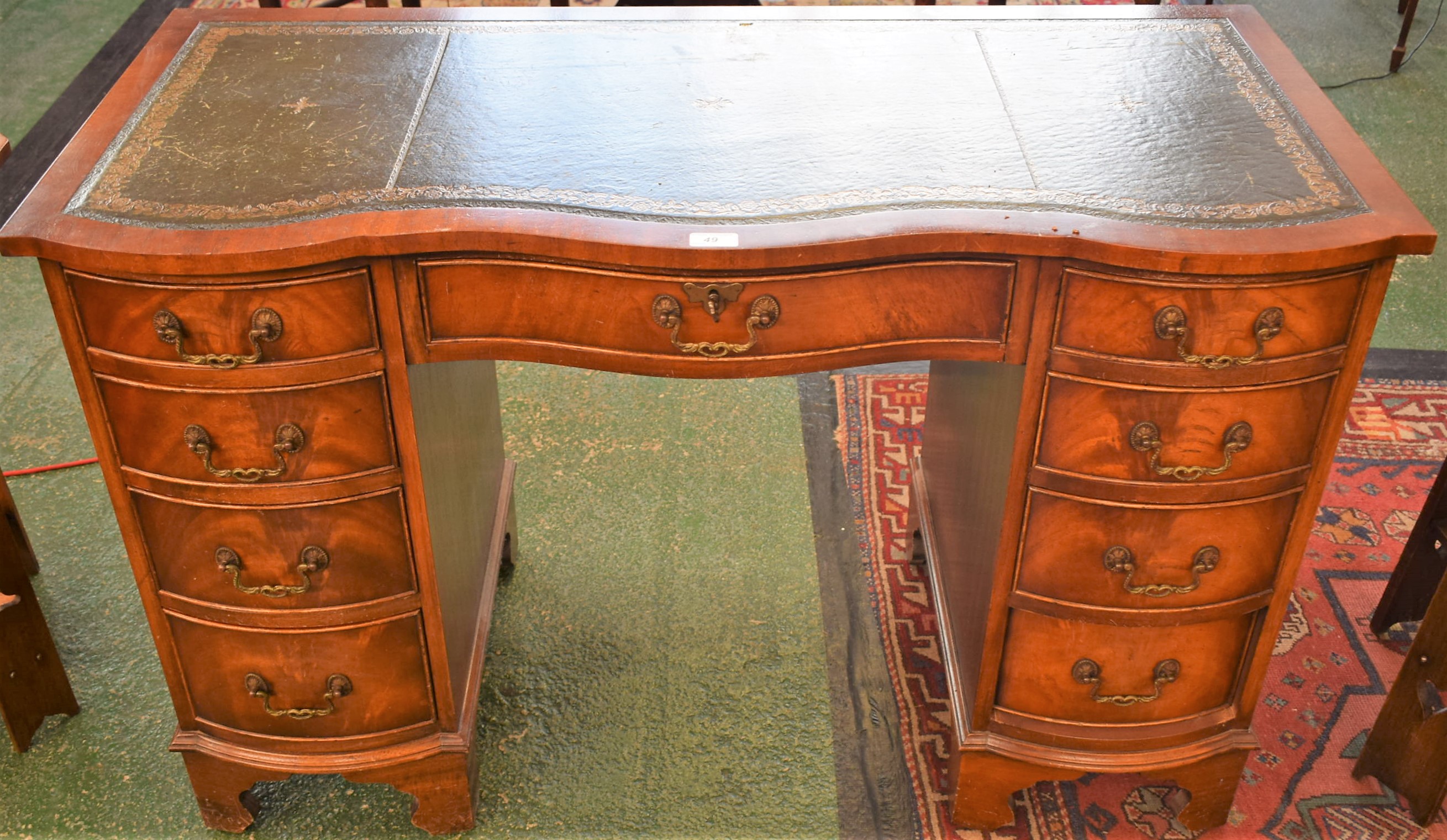 A reproduction mahogany writing desk,