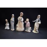 A Lladro figure of a boy; others, a kneeling girl, a little boy; two Spanish Zaphir figures,