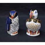 A Royal Crown Derby paperweight, Puffin, gold stopper; another, Rockhopper Penguin,