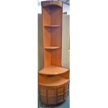 A teak floor standing corner display cabinet,