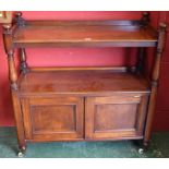 A Victorian mahogany buffet, the two tiers with three quarter galleries, turned pillars and finials,