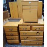 A 20th century pine chest of two short over three long drawers, plank sides, swing handles, 75.