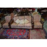 A 20th century mahogany 'Bergere' suite, comprising sofa and a pair of armchairs, cane back,
