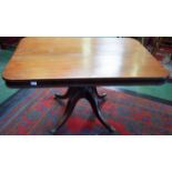 A post-Regency mahogany rounded rectangular breakfast table, moulded top above a deep beaded frieze,