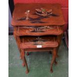 A 20th century mahogany Japanese style painted nest of three tables