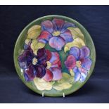 A Moorcroft Clematis pattern plate, on green ground, 25.