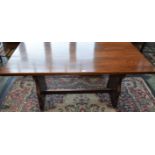 A 20th century oak trestle type dining table, 152.