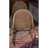 A pair of 20th century oak framed side armchairs, cane back,