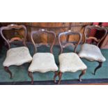 A set of four Victorian mahogany dining chairs, shaped cupid's bow cresting rails,
