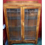 A 20th century mahogany display cabinet,