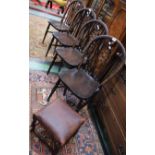 A set of four 20th century oak wheelback chairs;