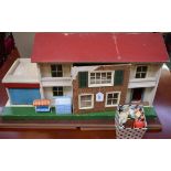 Dolls - a Tri-ang two storey 1970's style dolls house, hook locking front,