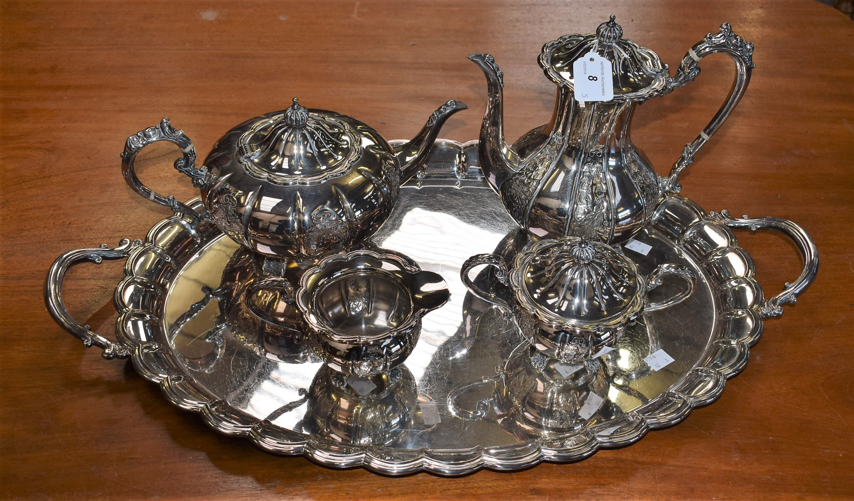 A Cavalier silver plated hand chased four piece tea service, comprising tea pot, coffee pot,