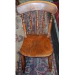 A 19th century elm spindle back side chair, curved cresting rail, well figured seat,
