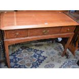 A Stag mahogany side table, rounded rectangular top above three drawers, tapered square legs, 106.