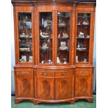 A reproduction mahogany dining suite, comprising a bookcase,