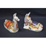 A Royal Crown Derby paperweight, Seated Llama, Collector's Guild Exclusive, gold stopper; another,