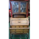 An Arts and Crafts oak bureau bookcase, stained glass doors,