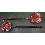 An early 20th century copper warming pan;