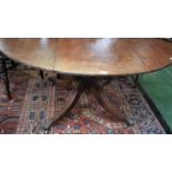 An early 19th century mahogany centre table, brass lion paw feet, 152cm wide, c.