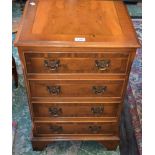 A small yew chest of drawers