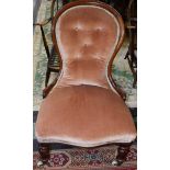 A Victorian mahogany spoonback nursing chair