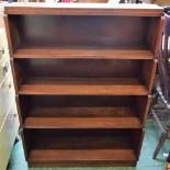 A stained pine four tier waterfall bookcase,