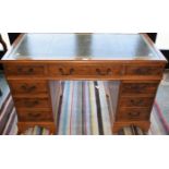 A 20th century yew twin pedestal writing desk,