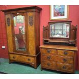An early 20th century mahogany bedroom suite, comprising wardrobe and dressing table,