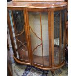 A glazed walnut display cabinet