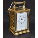 A lacquered brass carriage clock, white rectangular enamel dial, Roman and Arabic numerals,