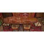 A George III style mahogany twin pedestal extending dining table,