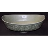 An oval bowl, Soholm, Denmark, in tones of mottled green,