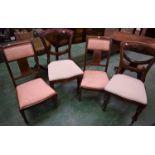 A pair of Edwardian mahogany inlaid nursing chairs;