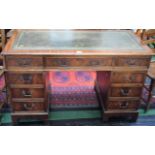 A reproduction mahogany writing desk,
