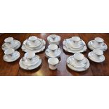 An Art Deco tea service, decorated with Arabesque, comprising bread plates (2), milk and sugar,