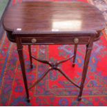 An Edwardian mahogany side table, shaped top above a single frieze drawer,