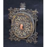 A 19th century jewelled brass oval photograph frame, hinged cover,