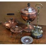 A 20th century brass and copper samovar; a similar kettle; a cast metal and brass door stop;