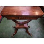 A Regency mahogany card table, hinged top enclosing a baize lined playing surface,