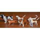 A Beswick Fox; three hounds,