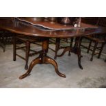A 20th century oak twin pedestal dining table,