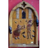 A carved arched wood panel, The Pied Piper of Hamlyn, 61.5cm high, 39.
