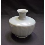 A Chinese Longquan celadon ovoid lotus vase, moulded in relief with a frieze of stepped leaves,