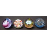 A Caithness paperweight, Neon; two others, similar,