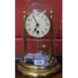 A 20th century brass anniversary clock, cream dial, bold Arabic numerals, minute track,