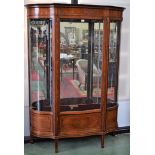 A large Edwardian mahogany and marquetry serpentine display cabinet,