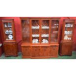 A reproduction mahogany breakfront bookcase,