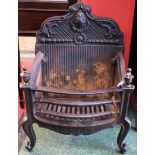A 20th century cast iron fire basket, shaped cresting cast with a shell, rose,
