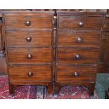 A Victorian mahogany chest of four short graduated cockbeaded drawers, of narrow proportions,